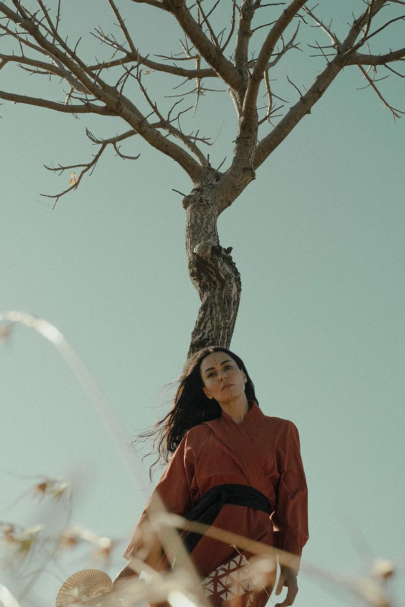 Portrait from Bali · 2024 — gaze and stillness by a tree